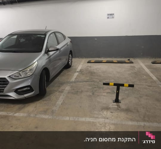 מחסום חניה חשמלי אישי מותקן בתא חניה בחניון תת קרקעי